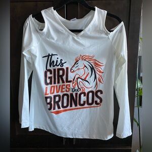 Long sleeve cold shoulder “This Girl Loves the Broncos” shirt. NWOT. Size S